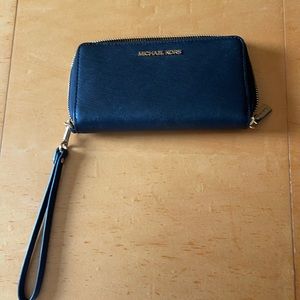 MK Wallet with wrist band. Used only a few times.